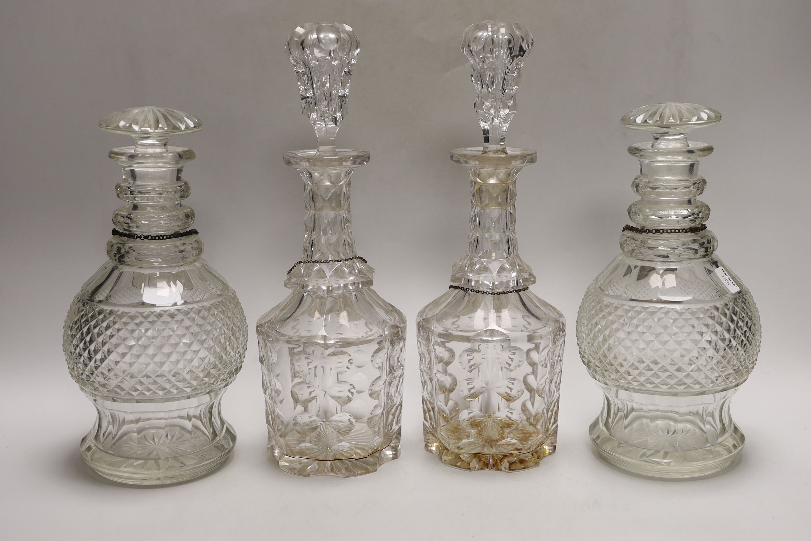 Two pairs of Victorian decanters, a silver wine label and three others